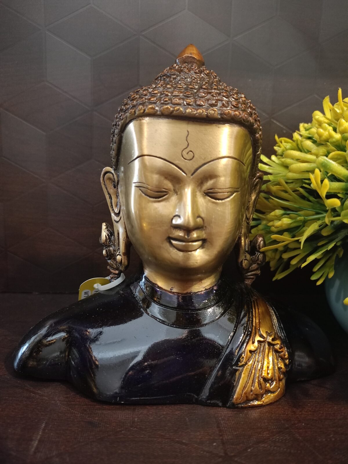 brass colored buddha idol